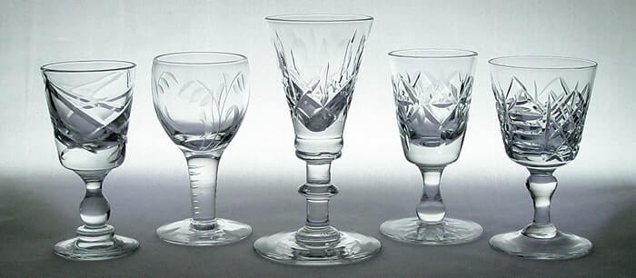 A selection of British cut glass lead crystal drinking glasses.